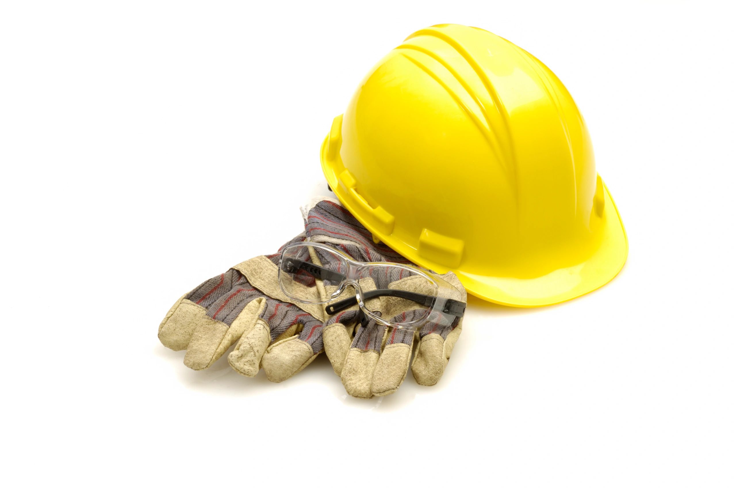Hard hat and gloves representing PPE safety gear