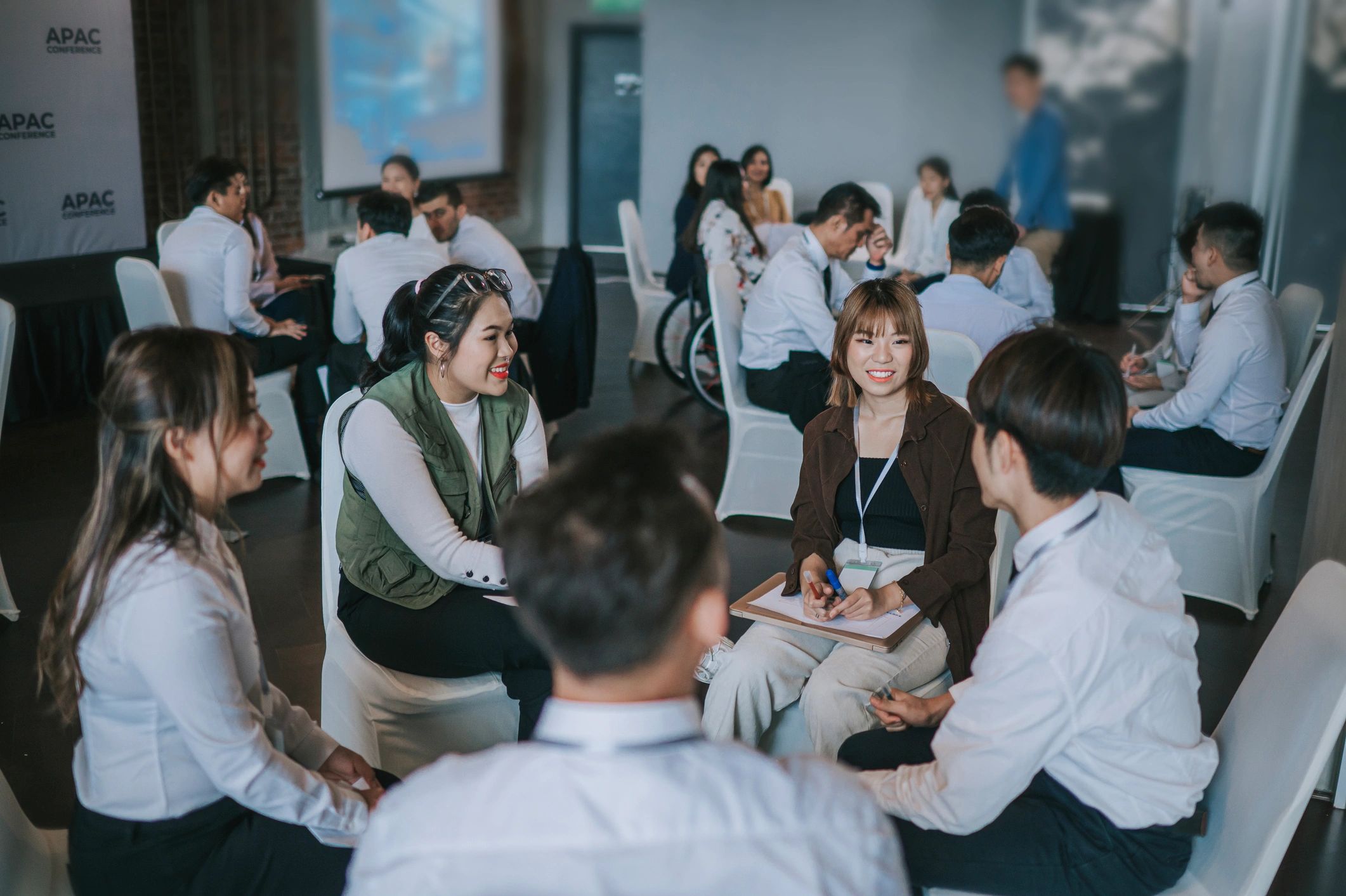 Facilitated stakeholder workshop with participants collaborating at a table