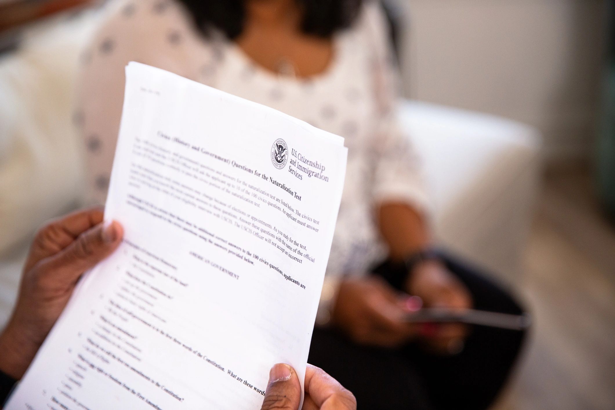Person reviewing documents at home
