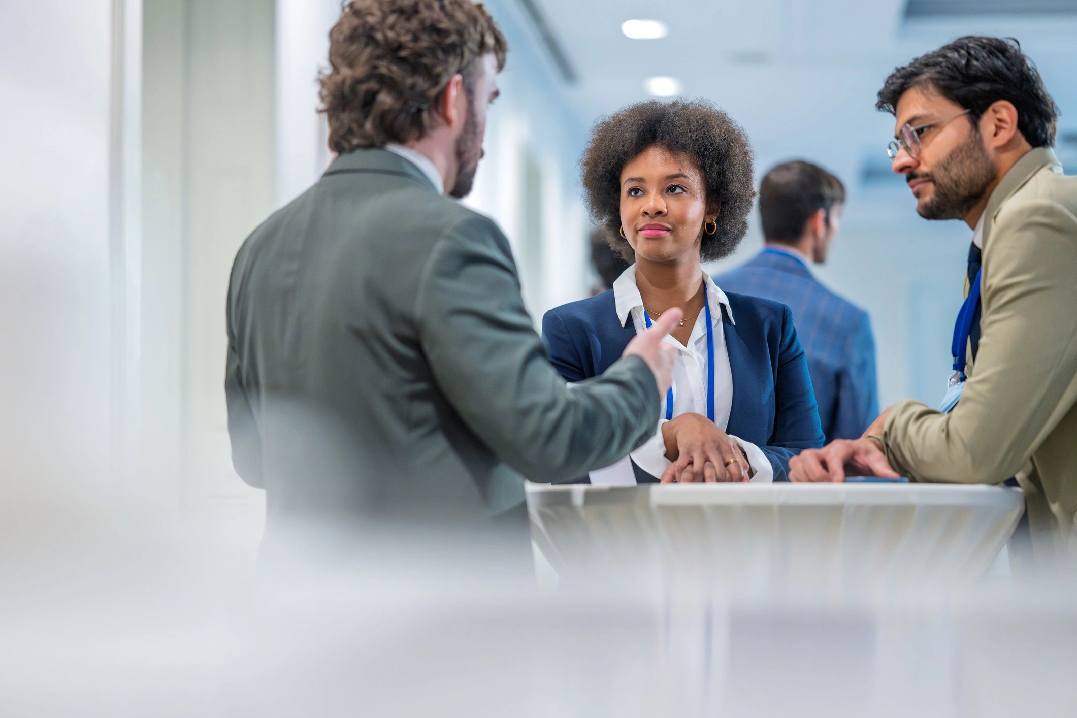 Professionals networking and discussing partnerships at a business event