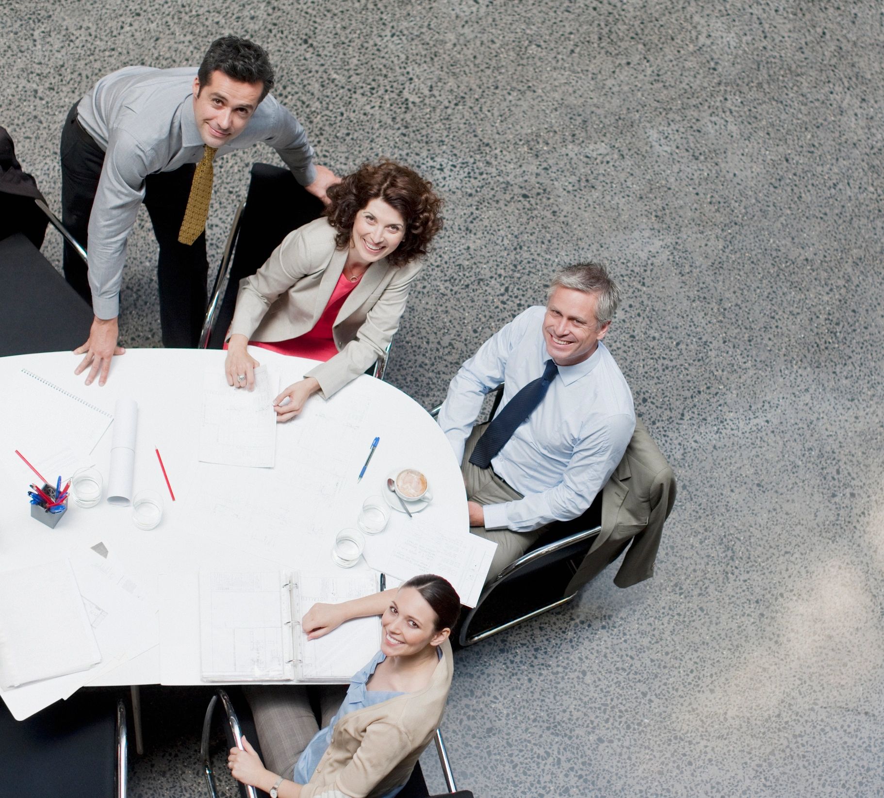 Overhead view of a business meeting at a conference table